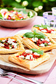 Puff pastry tartlets with feta, zucchini, and peppers