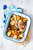 Bacon wrapped chicken breast with oven roasted vegetables
