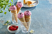 Currant ice cream with poppy seeds in a waffle cones