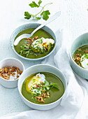 Spring green soup with poached egg