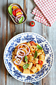 Summer noodle soup with cannelloni beans and cherry tomatoes