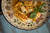 Fettuccine with cheese, tomato, and basil