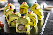 Green sushi with avocado and tempura prawns