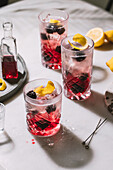 Blackberry spritz with fresh blackberries, ice and lemon zest