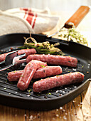 Pork sausage without skin on a grill pan