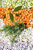 Vegetable cubes (celery, carrots, celeriac, onion) with bay leaf and rosemary