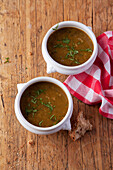 Brown onion soup with flat-leaf parsley