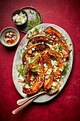Roasted squash with pomegranate, dill, feta and chili oil