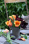 Fringed tulips in a metal container and Easter eggs