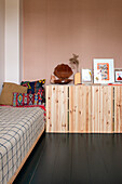 Wooden chest of drawers in the bedroom with ethnic decoration