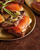 A slice of wholemeal bread topped with smoked salmon