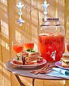 Tramezzini sandwiches and grapefruit cocktail