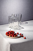 Wild apples, glass bottle and drinking glass