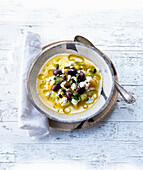 Greek lemon chicken soup with olives and feta