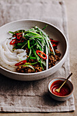 Rice noodles with spicy sauce, chilli and marinated minced pork