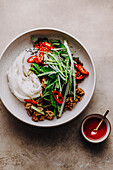 Rice noodles with spicy sauce, chilli and marinated minced pork