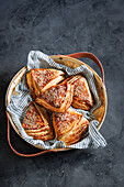 Pretzel corners made from Danish pastry with sesame and fleur de sel