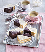 Bicolor cake slices with nuts and chocolate