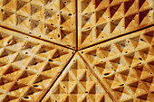 Extreme close up textured corners of waffles\n