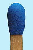 Close up blue matchstick on blue background\n