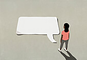 Woman looking down at communication speech bubble\n