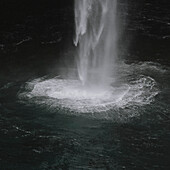 Waterfall splashing into sea, Gasadalur, Vagar, Faroe Islands\n