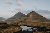 Scenic view hills and river in remote landscape, Klakkur, Klaksvik, Faroe Islands\n