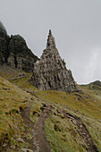 Rock formation on grassy mountain slope, Old Man of Storr, Isle of Skye, Scotland\n