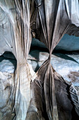 Aerial view ripped protective tarpaulin over Rhone Glacier, Switzerland\n