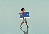 Female consumer carrying large credit card\n