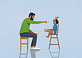 Father feeding messy baby in high chair\n