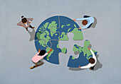 Global business people connecting earth jigsaw puzzle\n
