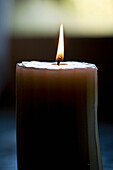 Close up of burning scented candle\n