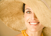 Woman wearing straw hat\n