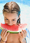 Young girl eating water melon\n