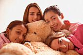Teenage girls Hugging Teddy Bear\n