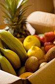 Close up of a box full of organic fruit\n