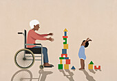 Ältere Großmutter im Rollstuhl beobachtet glücklichen kleinen Jungen beim Spielen mit Bauklötzen
