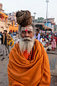Half-length portrait of a Sadhu with hair up, Varanasi, Uttar Pradesh, India\n