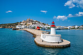 Harbour lighthouse and the old town of Ibiza with its castle seen from the harbor, UNESCO World Heritage Site, Ibiza, Balearic Islands, Spain, Mediterranean, Europe\n