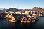 Fishing village and town of Svolvaer at sunrise in autumn, aerial view, Lofoten Islands, Nordland, Norway, Scandinavia, Europe\n