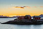 Red rorbu at sunrise, Svolvaer, Lofoten Islands, Nordland, Norway, Scandinavia, Europe\n