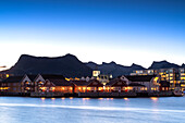 Illuminated houses at dusk, Svolvaer, Lofoten Islands, Nordland, Norway, Scandinavia, Europe\n