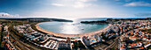 Aerial drone panoramic view of Sao Martinho do Porto bay, shaped like a scallop with calm waters and fine white sand, Oeste, Portugal, Europe\n