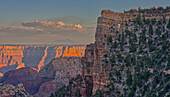 Closeup of Angel's Window at Cape Royal on North Rim above Unker Creek near sundown, with brown haze on the horizon smoke from a wildfire near the park, Grand Canyon National Park, UNESCO World Heritage Site, Arizona, United States of America, North America\n