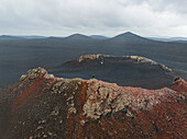 A person enjoy the beautiful landscape from the mouth of old volcano, Highlands, Iceland, Polar Regions\n