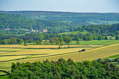 View of farmland and Chatsworth House in spring, Derbyshire Dales, Derbyshire, England, United Kingdom, Europe\n