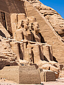 The Great Temple of Abu Simbel with its four iconic 20 meter tall seated colossal statues of Ramses II (Ramses The Great), UNESCO World Heritage Site, Abu Simbel, Egypt, North Africa, Africa\n