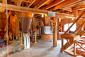 Interior of old wooden mill\n