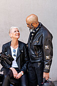 Cool mature biker couple in leather clothes\n
